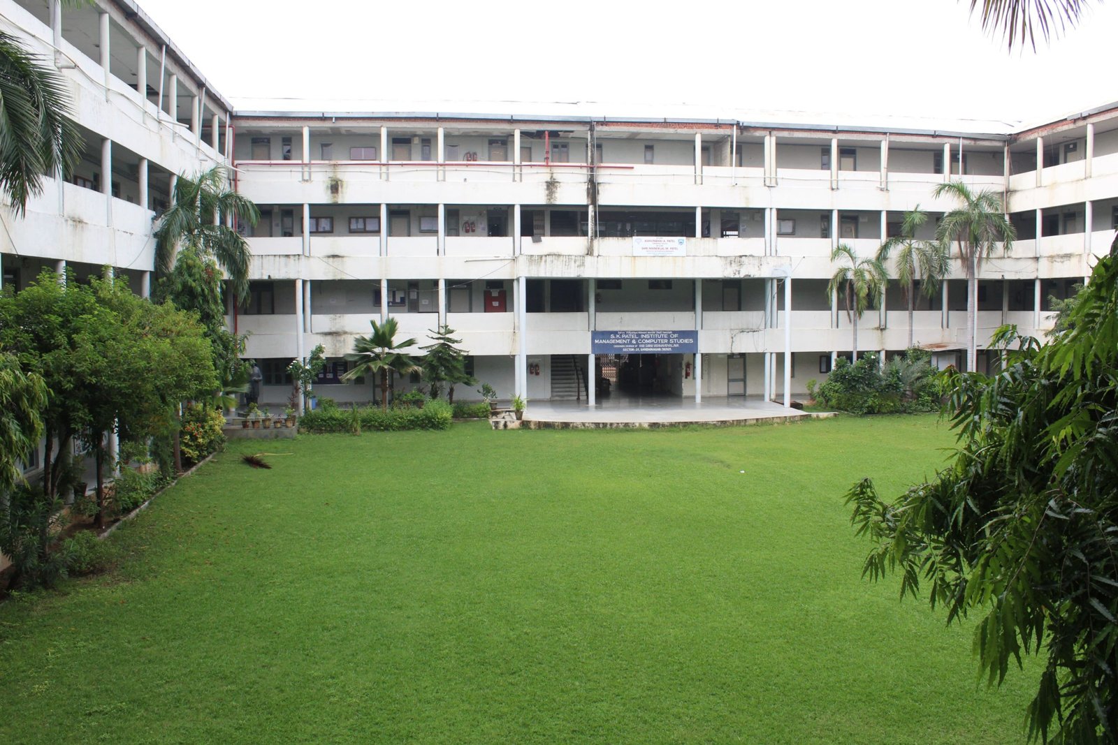 Green courtyard and academic block within the campus